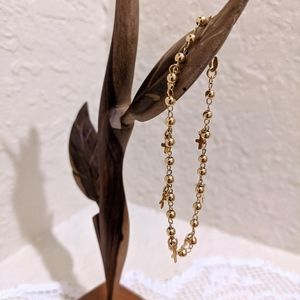 Gold bracelet with crosses